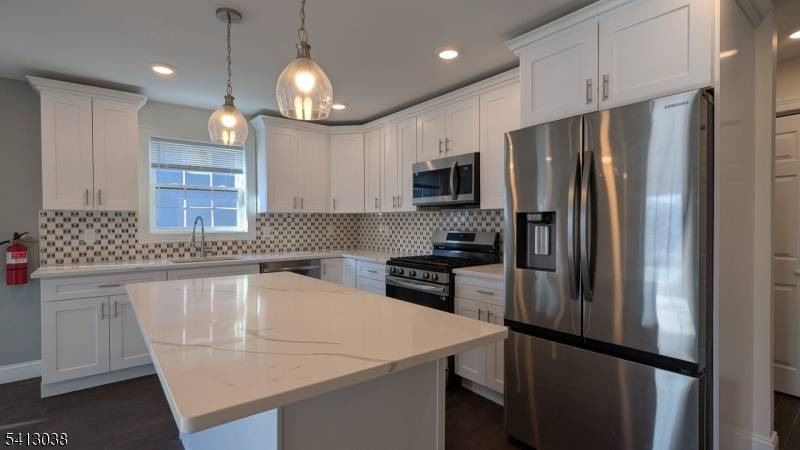 Newer construction legal two family home that lives like three separate living spaces, offering a rare and highly functional multi level layout on a corner lot in Bloomfield.