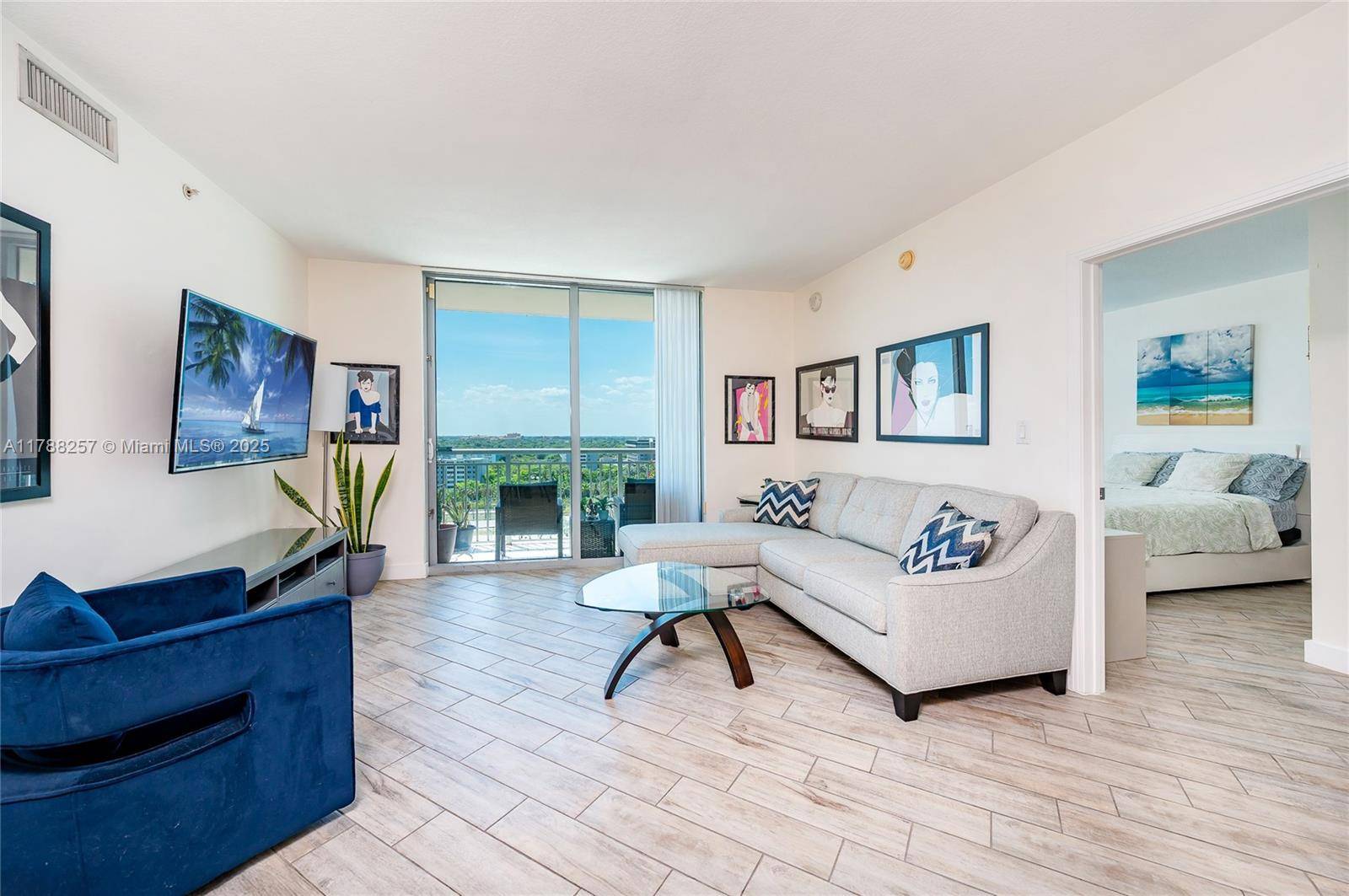 Best priced 2 2 condo in Metropolis with split floor plan, abundant natural light, and city views.