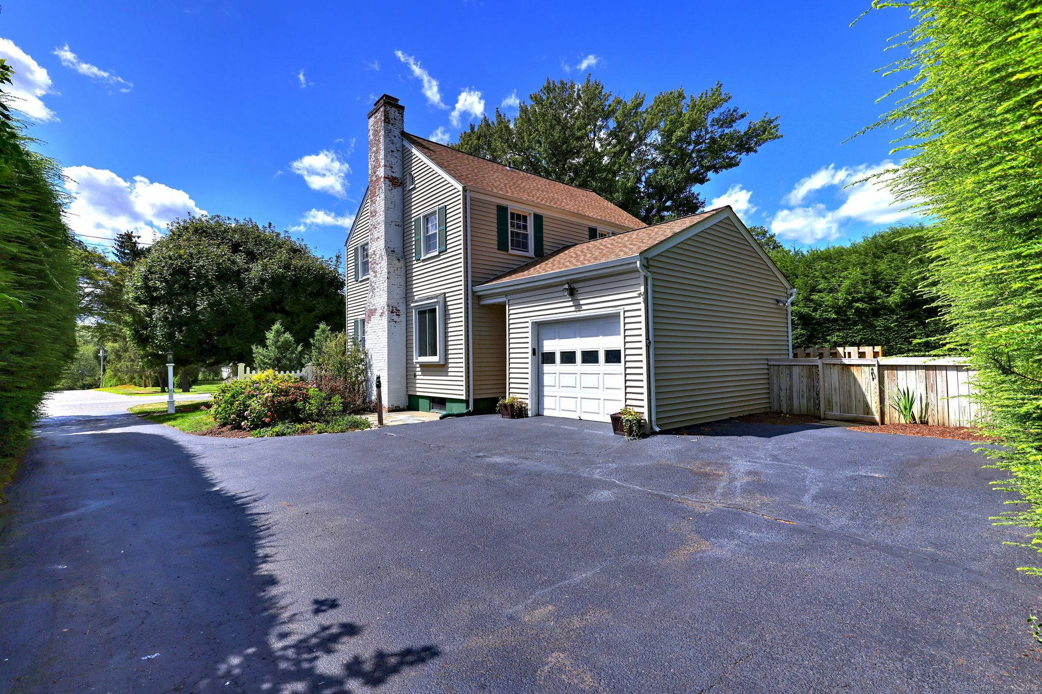 Charming 3BR 1. 5 Bath Colonial located in the heart of Long Hill situated on a level lot with private backyard.
