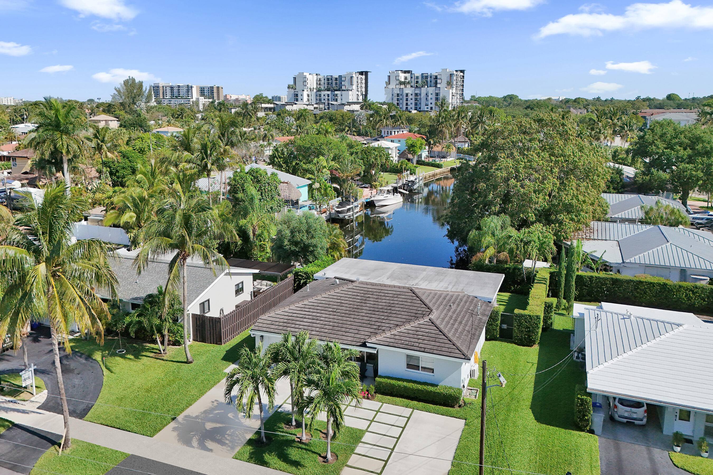 Perfectly positioned to capture rare, stunning waterway views looking straight down the canal w ocean access.