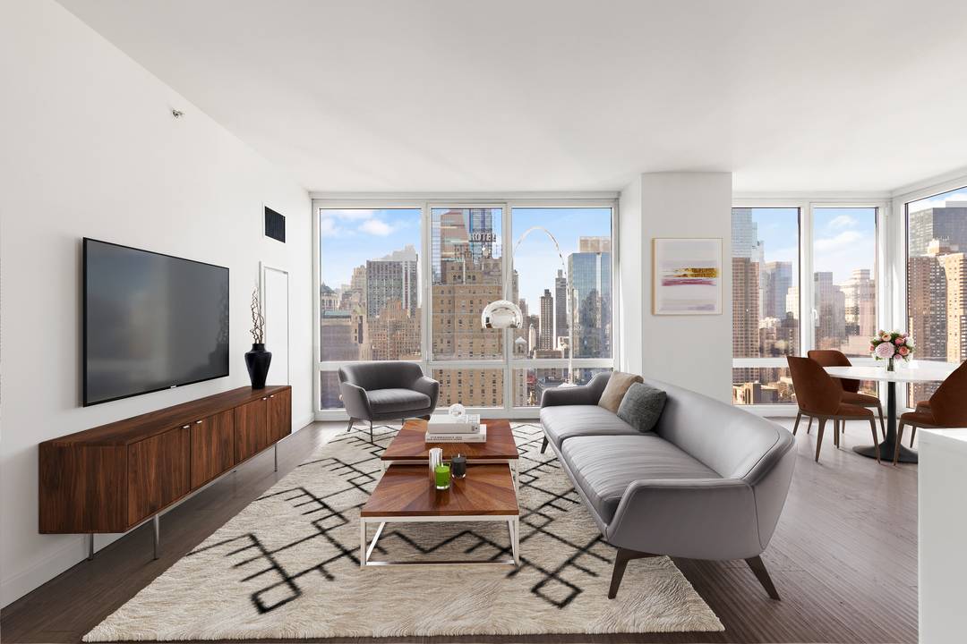 Superb, loft like corner 2 bedroom, 2 and 1 2 bath home in the award winning Platinum Condominium, located in the heart of the Theater District.