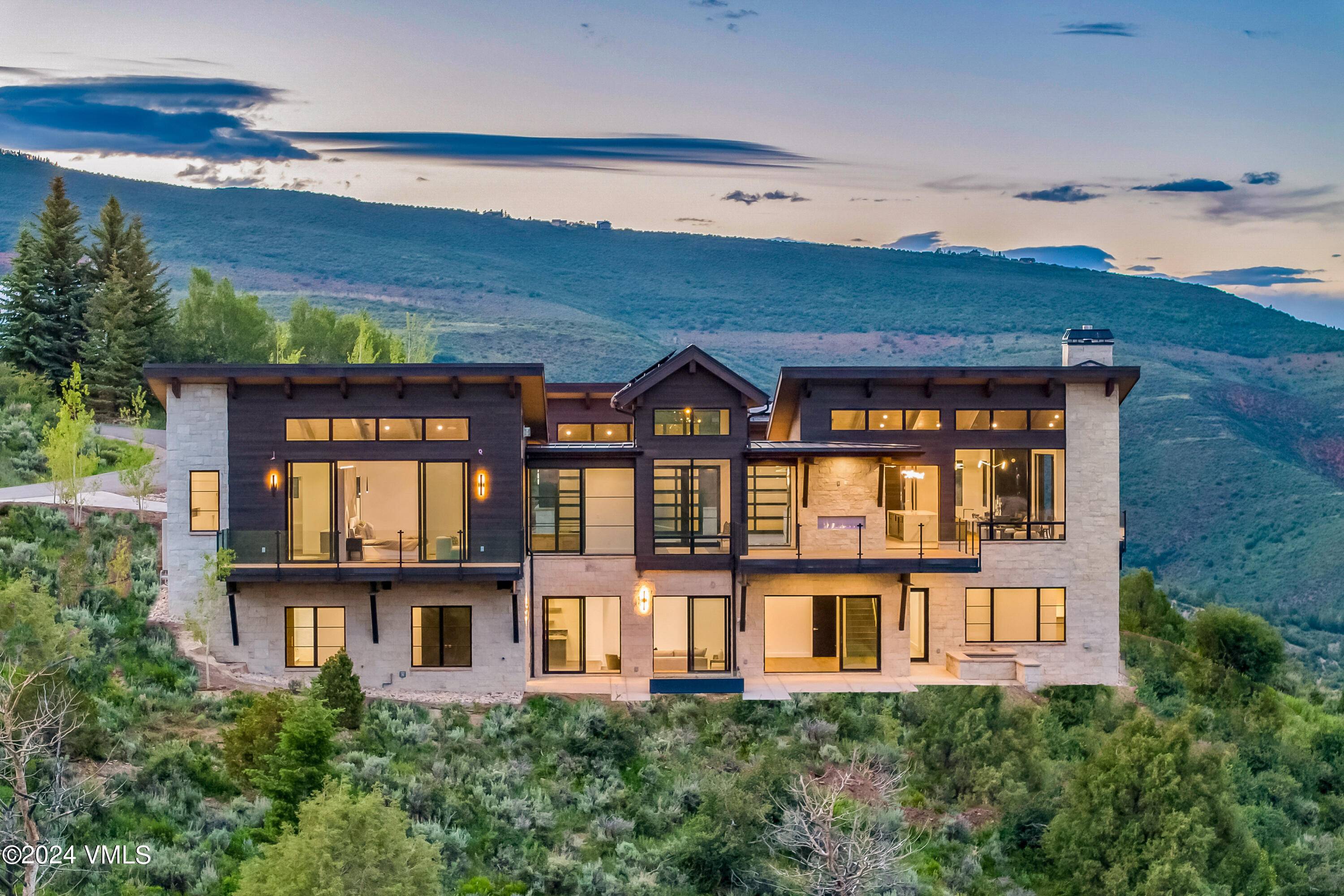 Welcome to 636 Saddle Ridge, a meticulously crafted masterpiece of transitional architecture on one of the most exceptional lots in the Ranch at Cordillera.