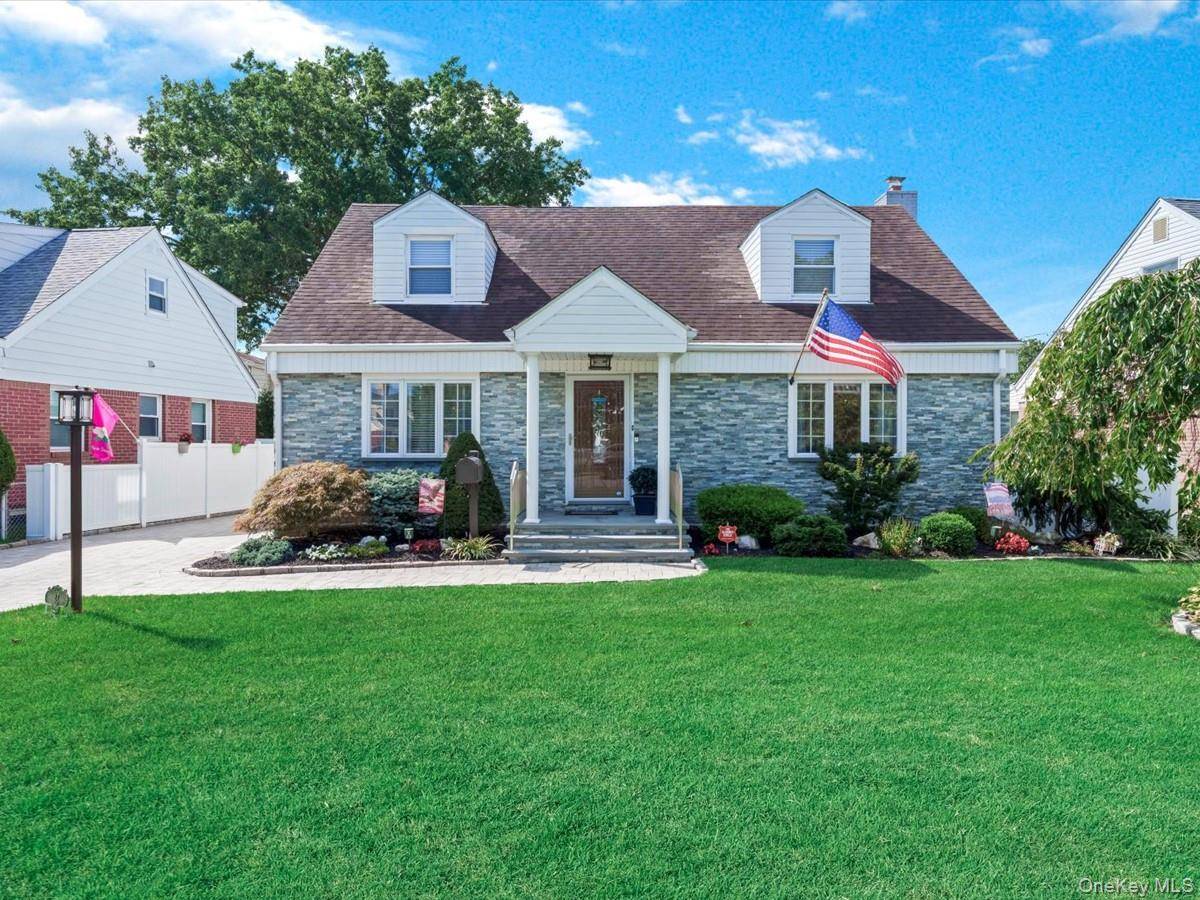 Welcome to this beautiful wide line cape, ideally located on a quiet street in the Herricks School District, just steps from Park Circle.