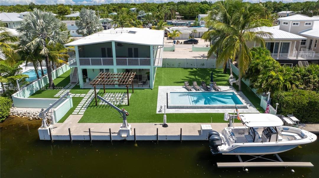 Welcome to your very own Florida Keys compound Set on an oversized 13, 000 sq ft Key Largo lot, this private oasis blends style, space, and tranquility perfectly.