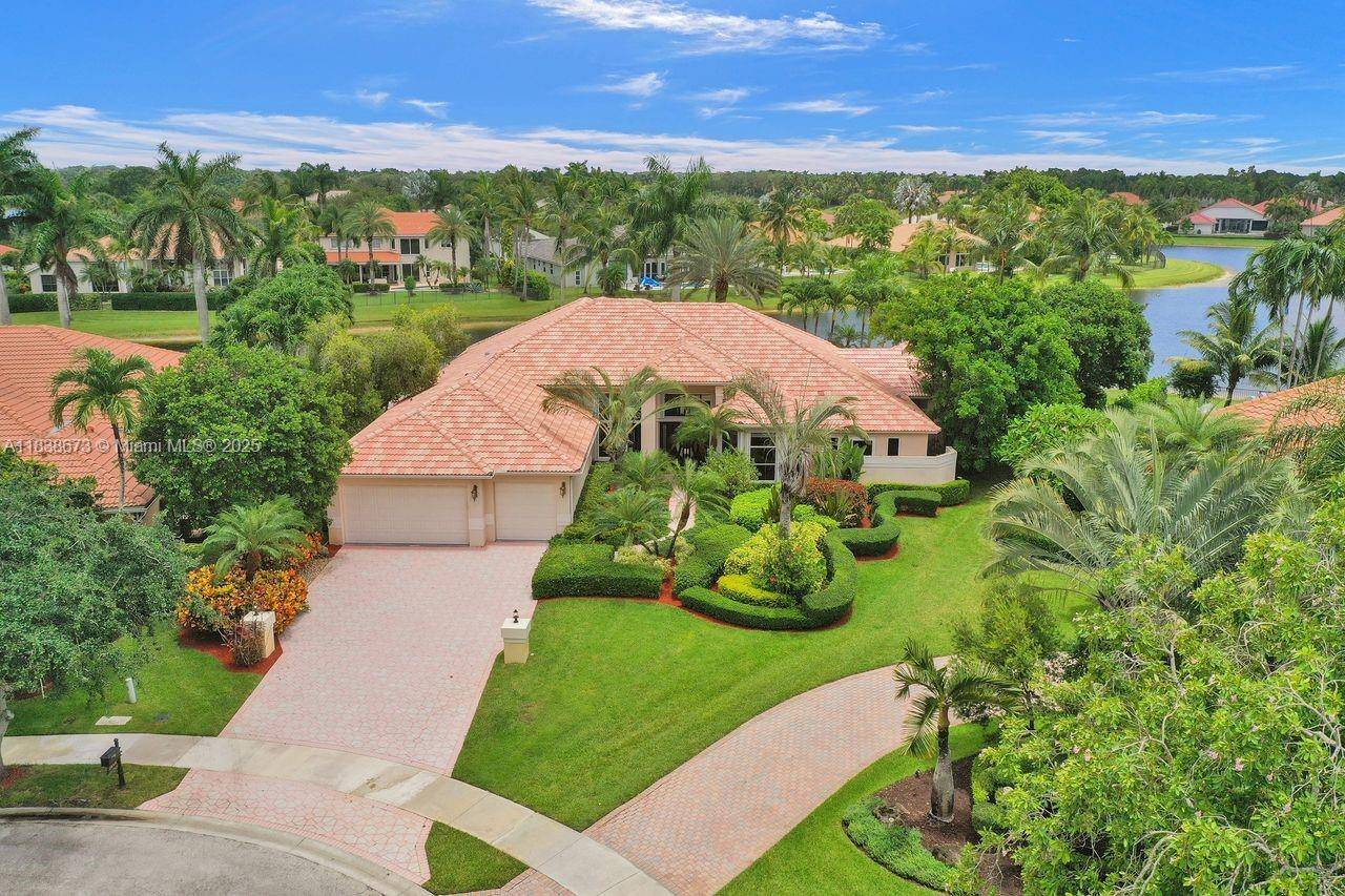 We are pleased to present this rarely available home in Weston Hills Country Club with huge 1 1 Guest House on over 1 2 acre waterfront point lot !
