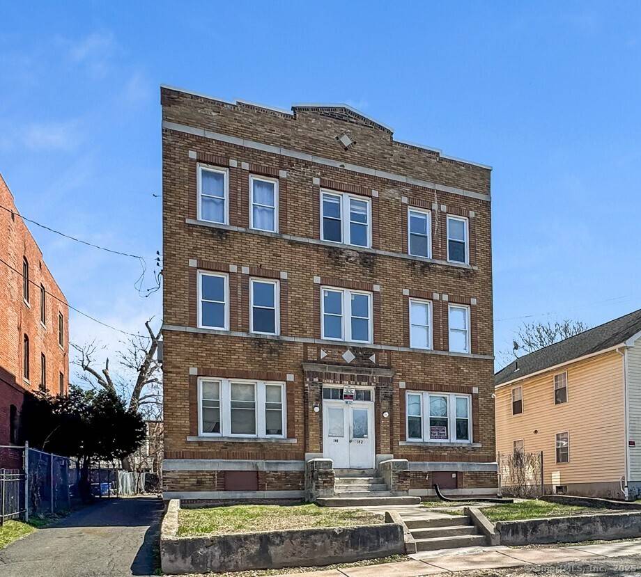 Fully rented brick six family property with off street parking.