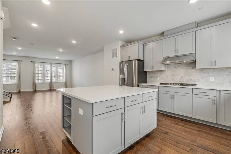 This stunning, three level townhome, built in 2022, offers 2, 000 sq ft of modern living in Livingston's sought after Livingston Square community.