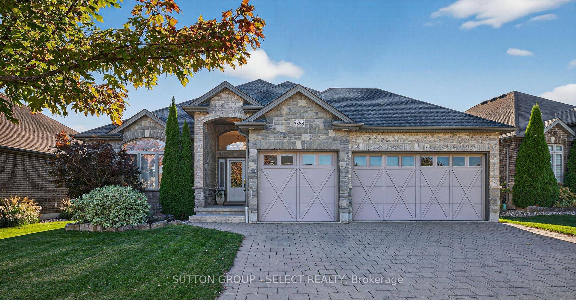 MINT FORMER MODEL ! Spacious 3 1 bedroom open concept one floor home with a triple car garage and finished lower.