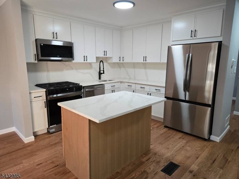 MOVE RIGHT IN TO THIS FULLY RENOVATED TOWNHOME !