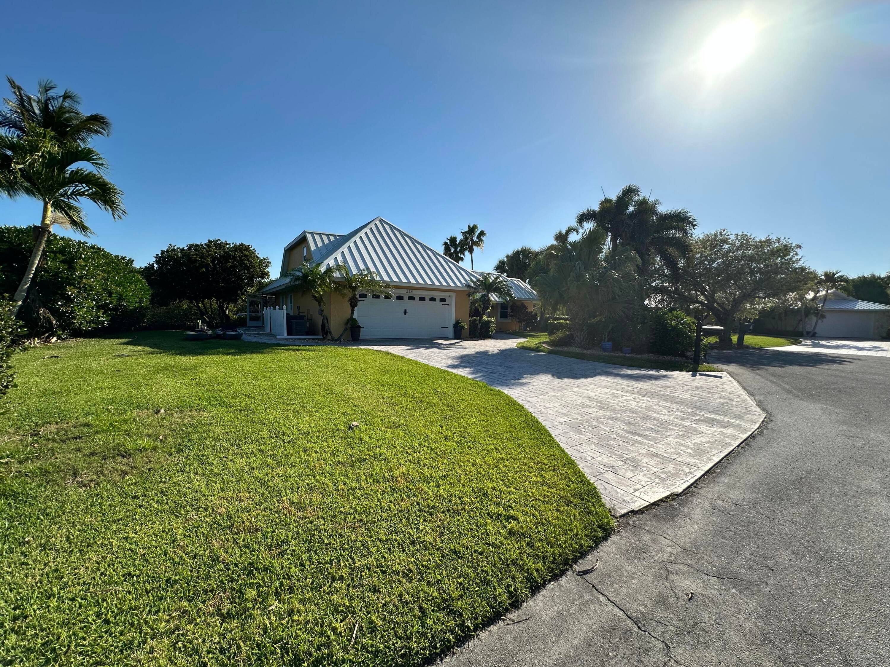 Island Luxury in Queens Cove Waterfront Paradise with Private Beach Access.