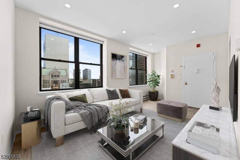 Experience modern city living at it's finest in this beautifully renovated 8th floor corner condo at Renaissance Towers, located in the heart of Downtown Newark.