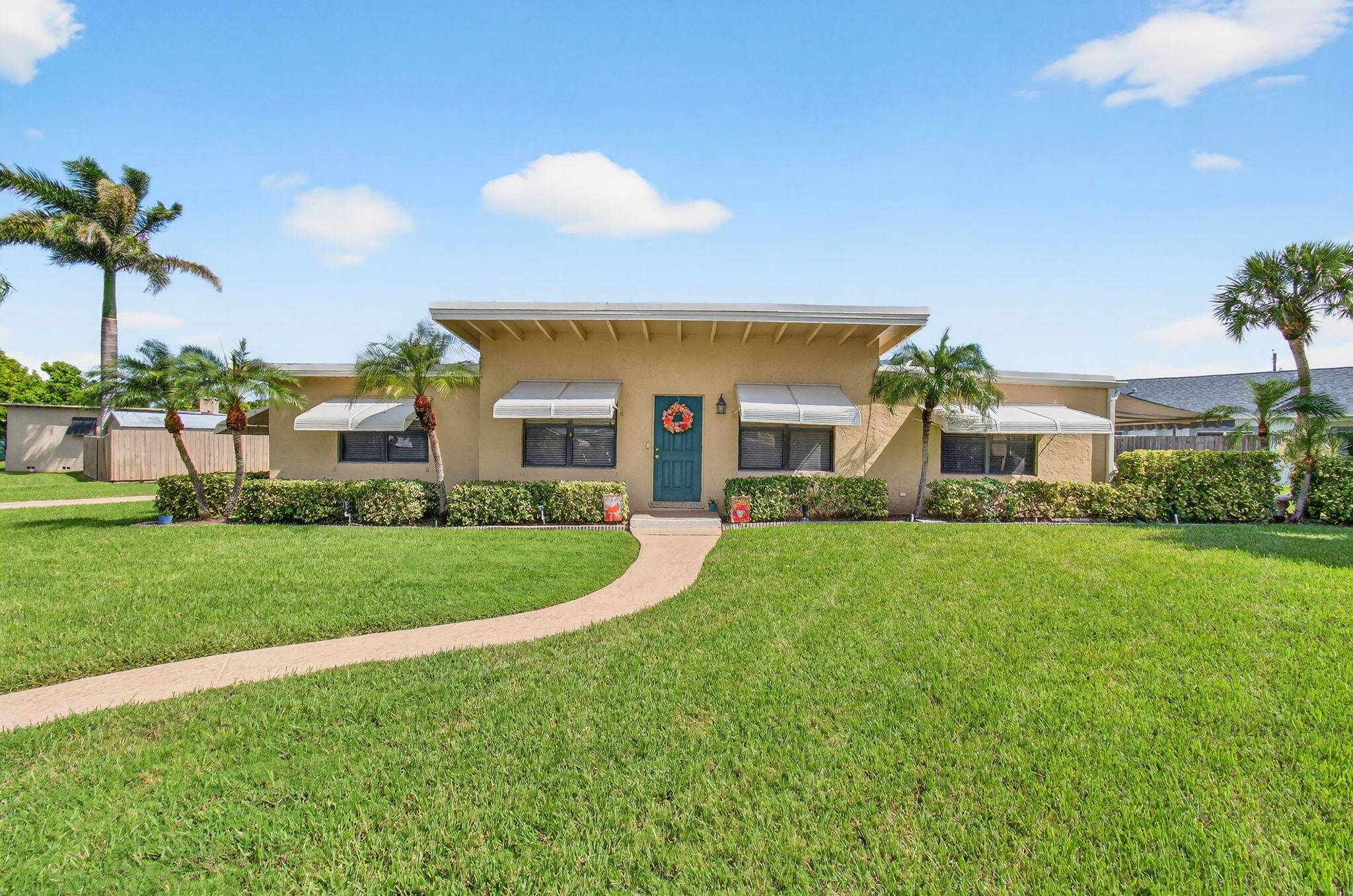 Located in one of Delray Beach's most desirable neighborhoods, Trade Winds Estates, this property offers a rare opportunity just one block from the Intracoastal Waterway.