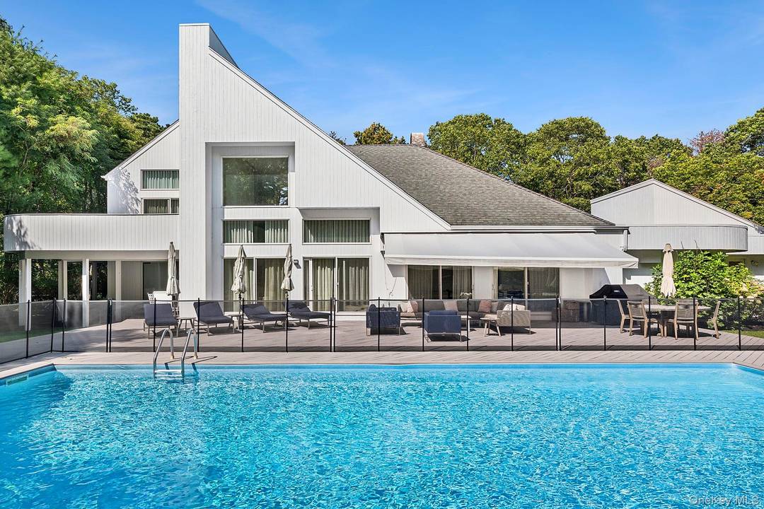 This stunning property boasts a chef s kitchen with luxurious marble countertops, and Moroccan tile floors, perfect for culinary enthusiasts.