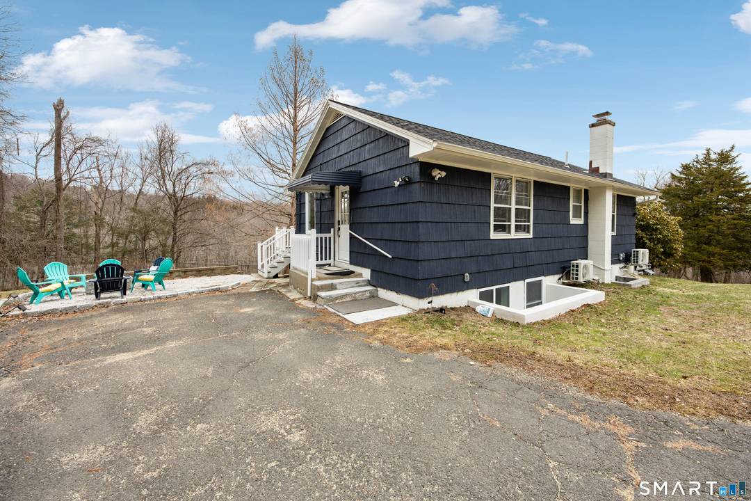 Welcome to 37 Church Hill Rd in Washington, a unique and versatile home set on a.