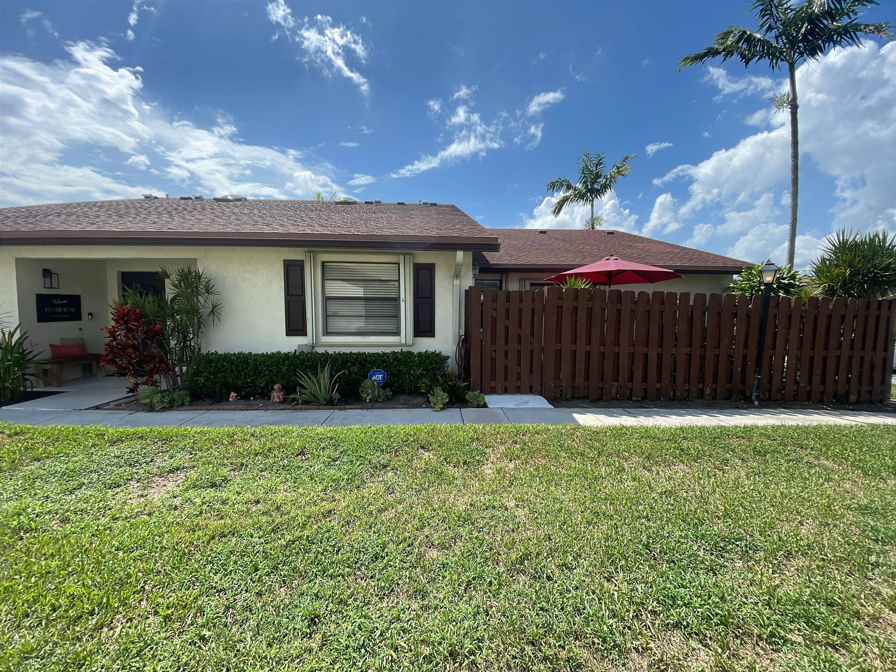 Charming Corner Villa nestled in a quiet desirable 55 Community.
