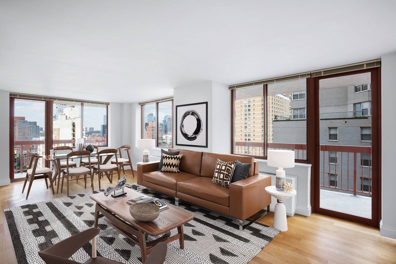 Spacious corner 2 bedroom with two private balconies, open corner views, a gourmet kitchen with stainless steel appliances and stone countertops, and wood floors throughout.