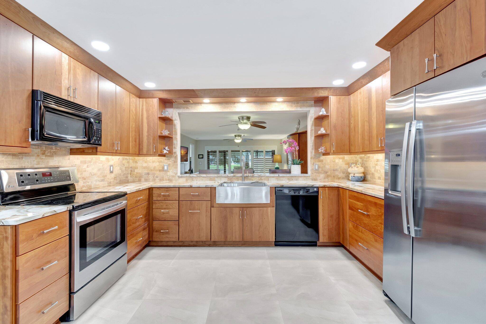 Great location on lake from front and rear of this completely remodeled 2BR 2BA 1st floor corner condo.