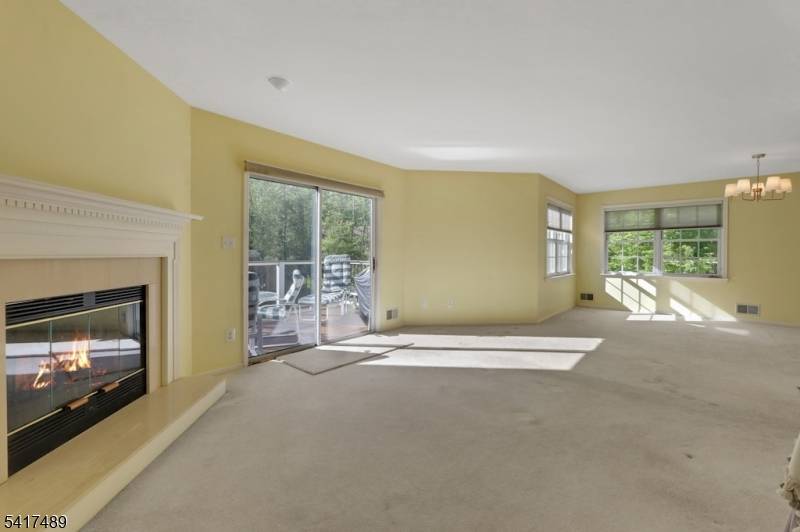 Exceptional value in this spacious 2, 292 square foot, three bedroom, two and one half bath townhome set in a private, wooded location in desirable Berkeley Square.