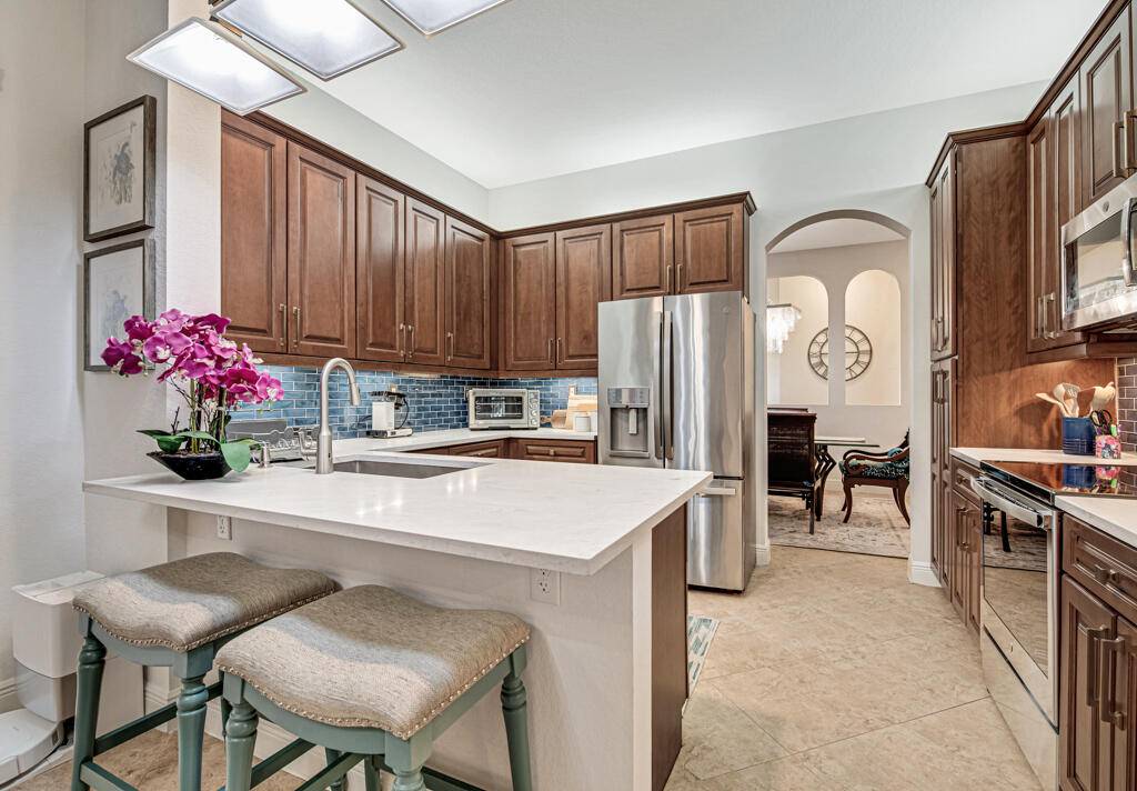 Absolutely stunning with magnificent lake views from this designer renovated home in the prestigious, 55, resort community of Baywinds !