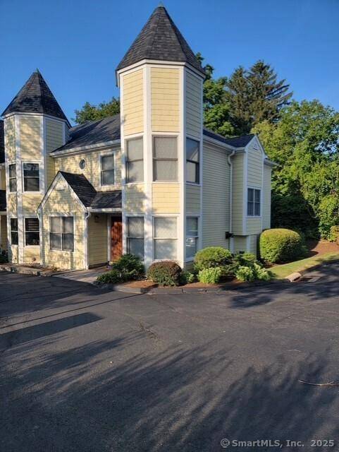 Welcome to this rare and sought after end unit townhouse in the charming Wisteria Gardens enclave, nestled just steps from the vibrant heart of downtown Ridgefield.