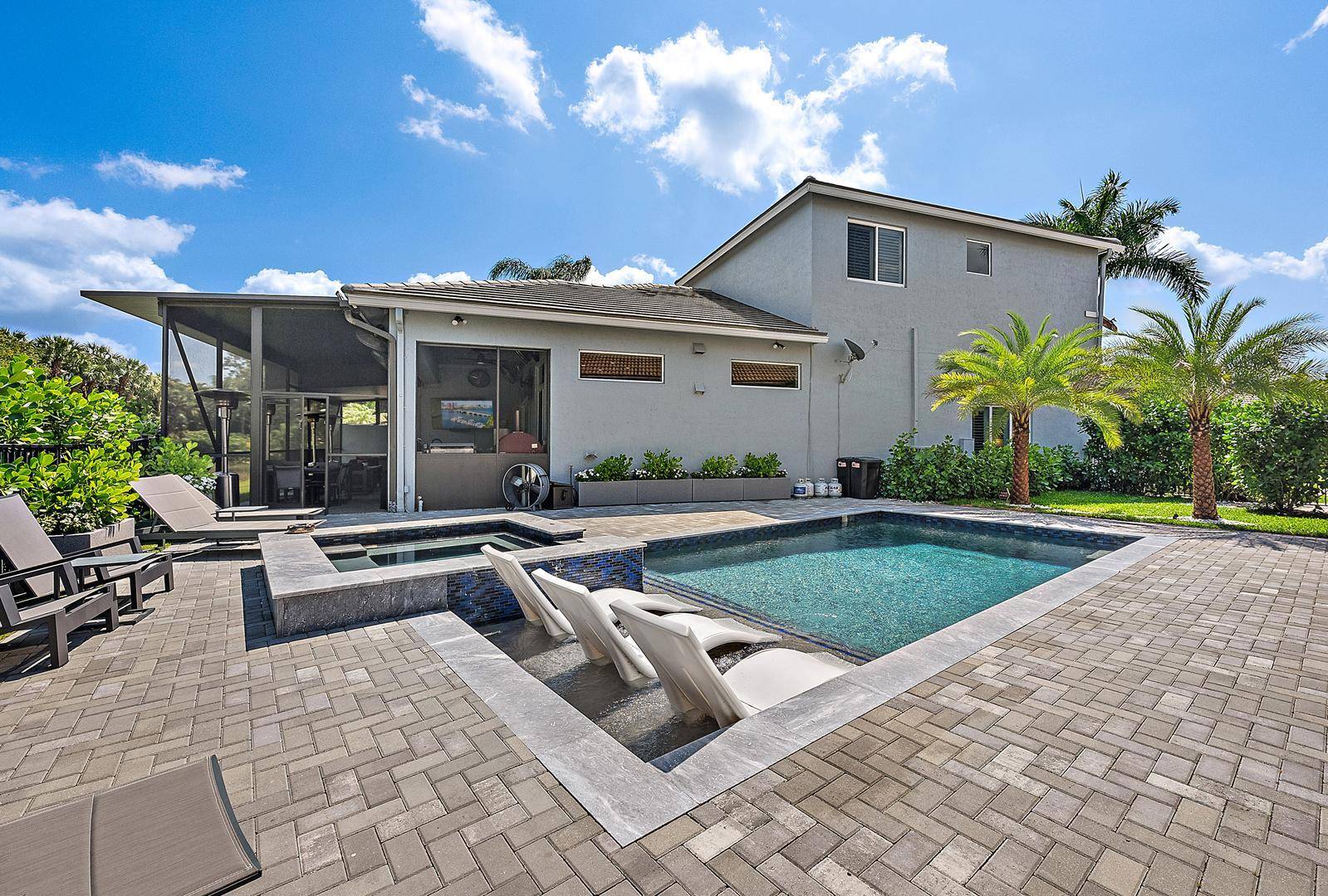 NOTHING COMPARES TO THIS STUNNINGLY AND TOTALLY REMODELED LAKEFRONT HOME WITH ALL CUSTOM AND DESIGNER FINISHES IN THIS TWO STORY HOME IN THE GRANDE SECTION OF IBIS.