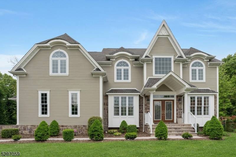 This magnificent custom home is situated at the end of a new cul de sac with views of the prestigious Country Club.