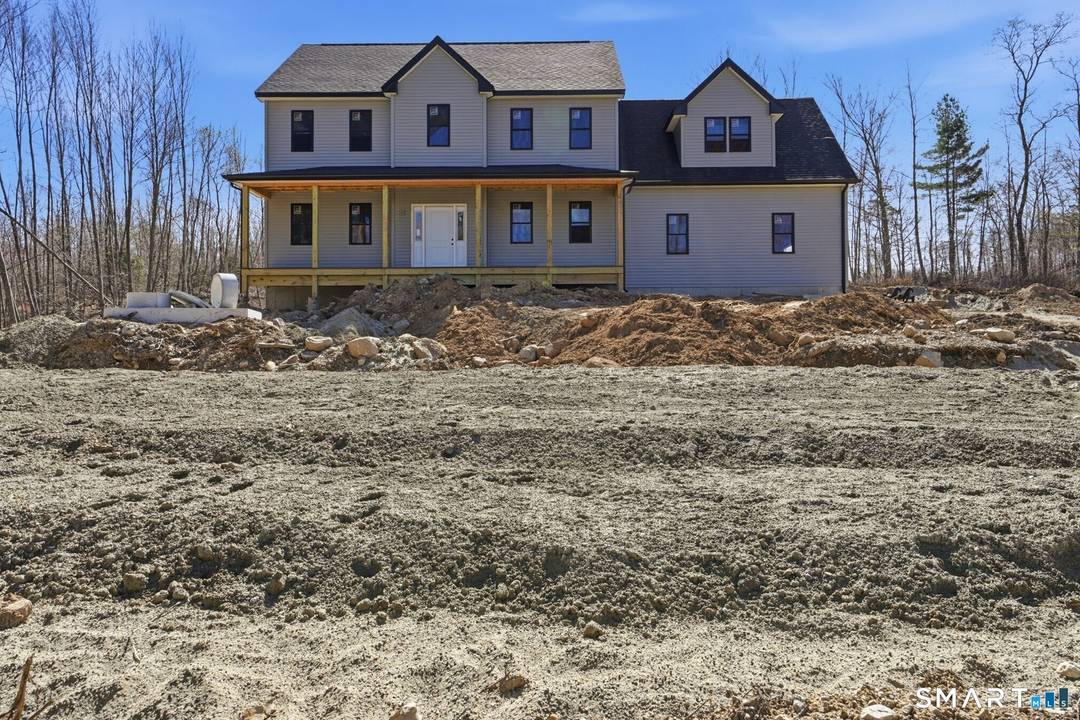 Stunning new construction Colonial set on over 2 private acres in a serene country location.