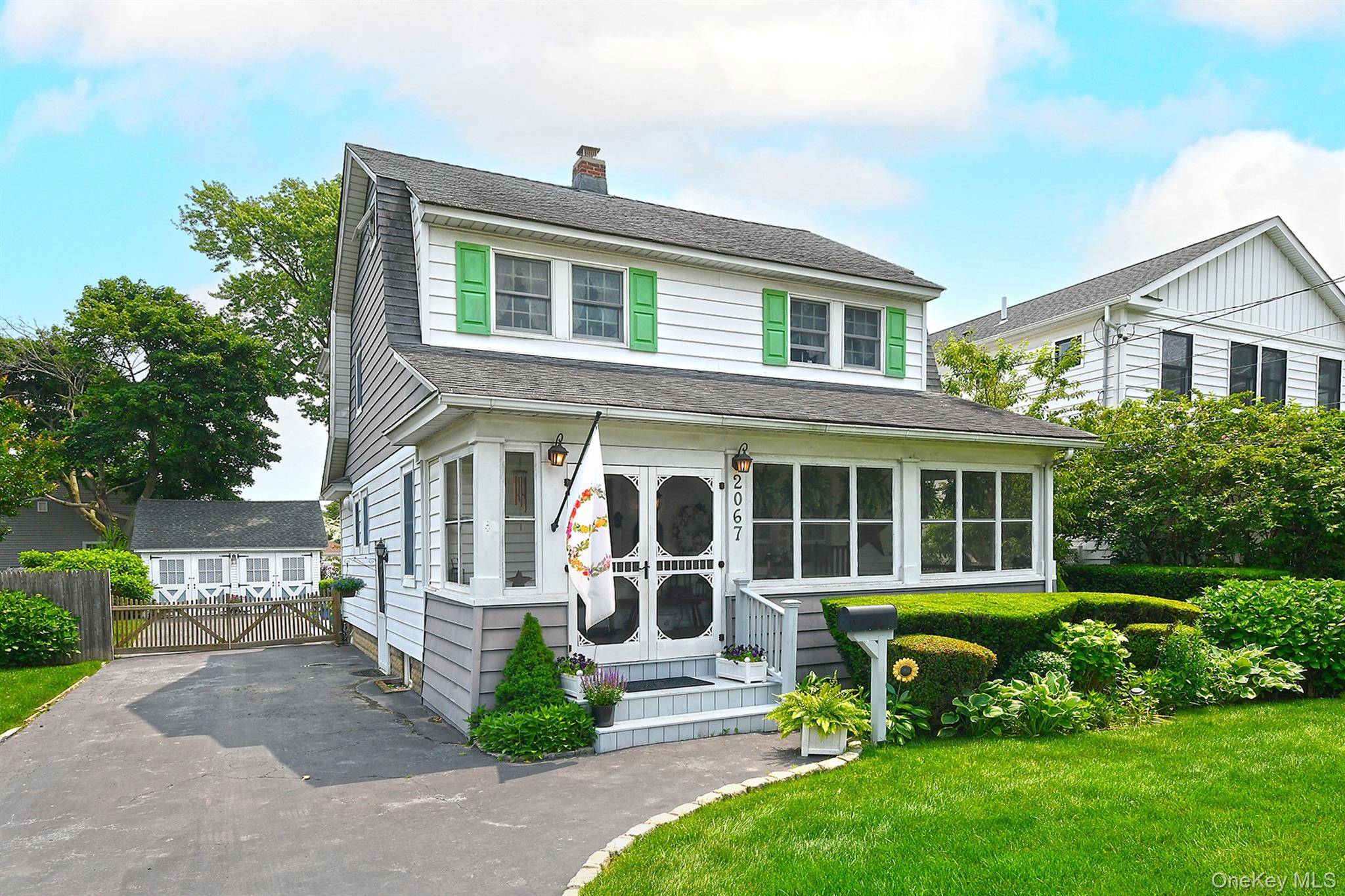 Welcome Home to this Enchanting Dutch Colonial featuring a delightful Enclosed Front Porch, Living room, large Formal Dining room, Kitchen, Mud room, 1 2 bath and a beautiful Family room ...