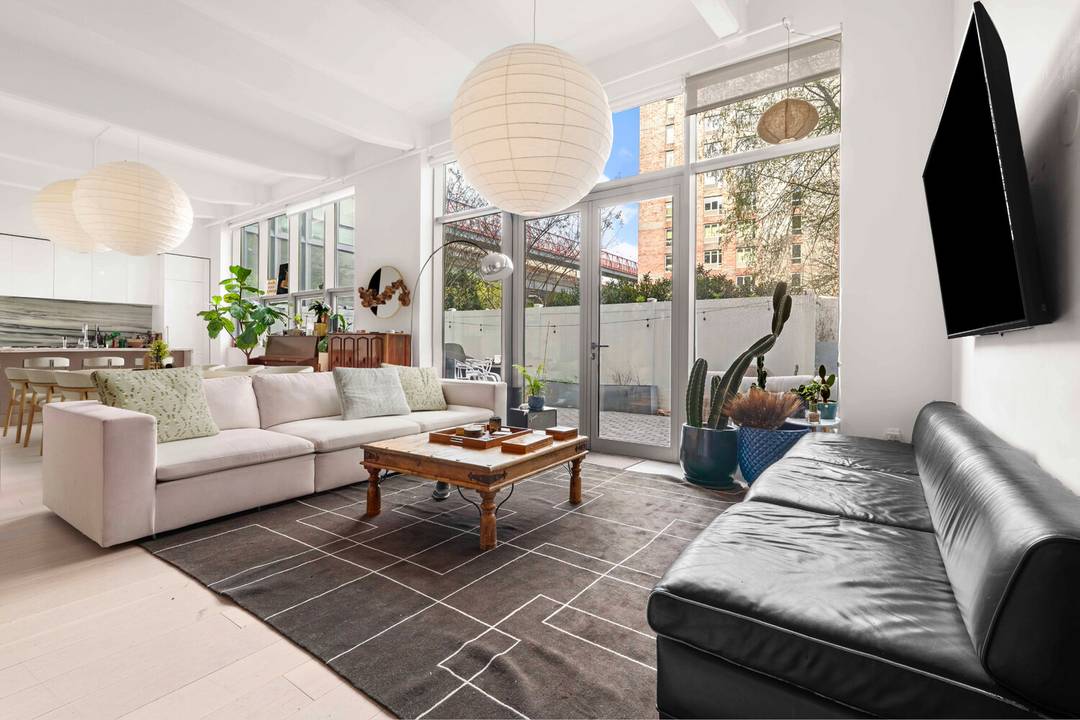 Expansive Garden Loft with Private Outdoor Space in Prime Williamsburg Welcome to Residence 1E at 338 Berry Street a spacious and thoughtfully designed 3 bedroom, 2.