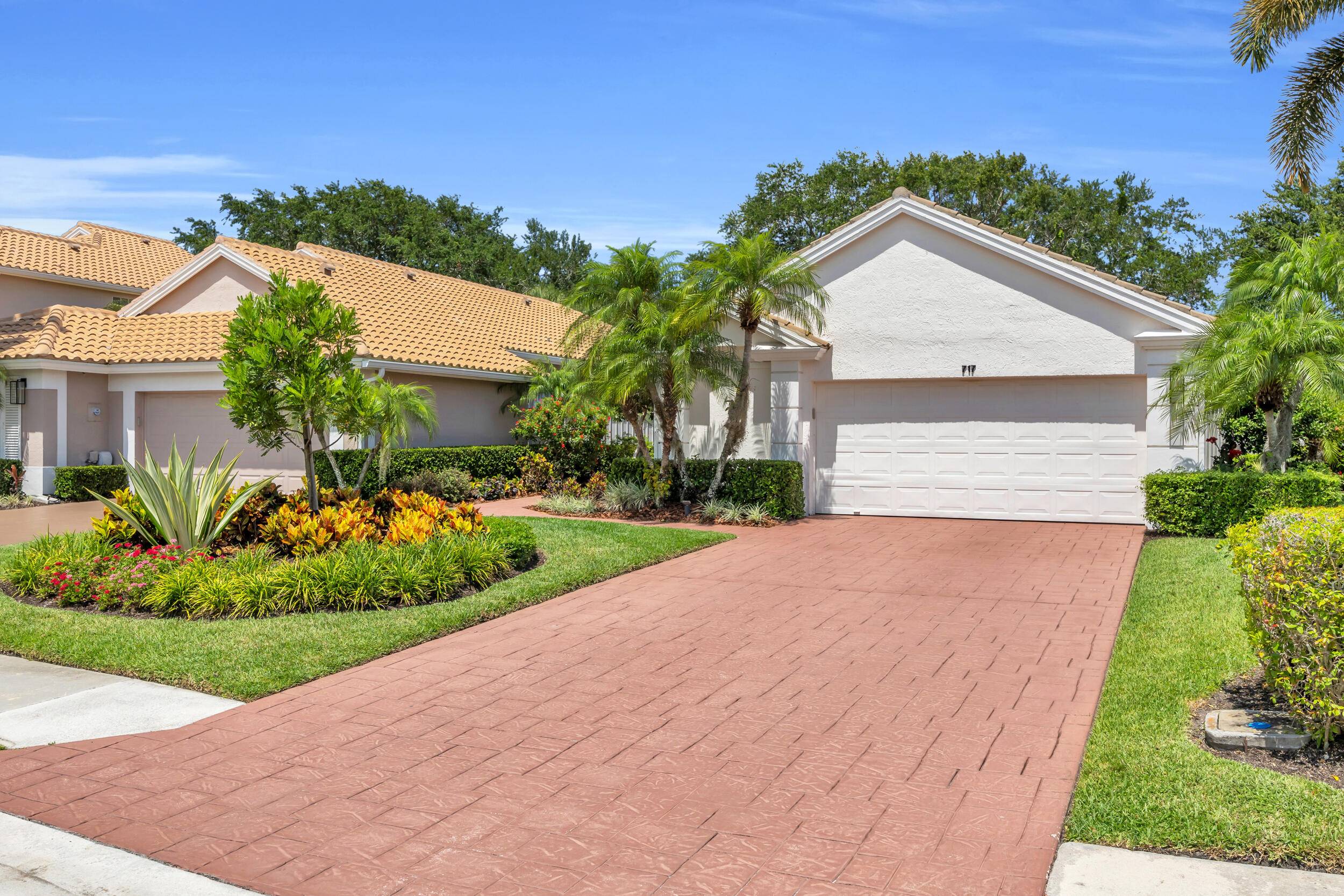 Located in the prestigious PGA National community of Palm Beach Gardens, this exceptional property at 717 Pinehurst Way is the epitome of luxury living.