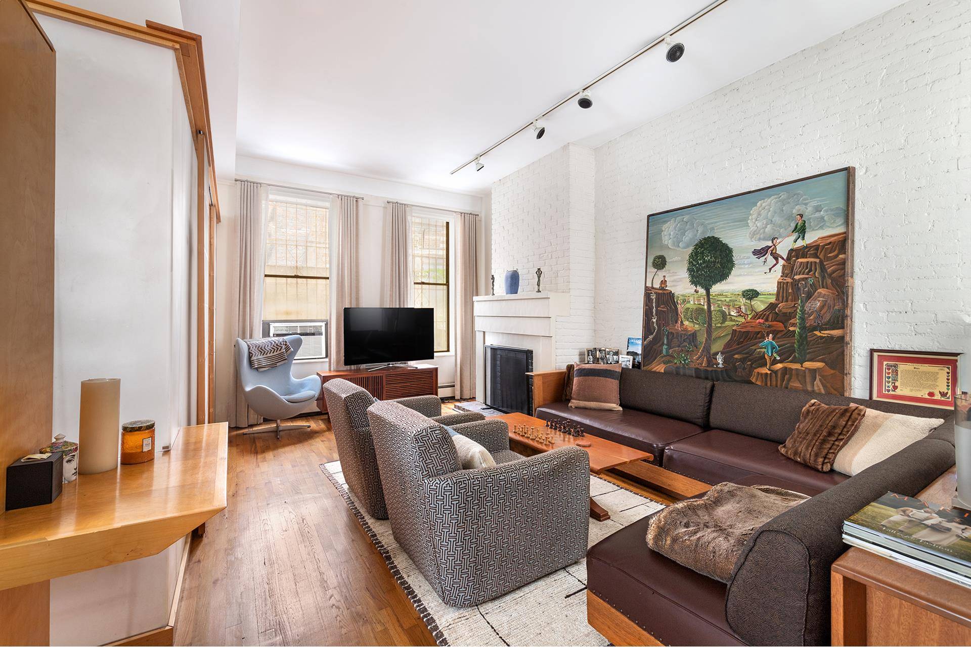 Move right into this spacious garden duplex in the highly coveted 325 West 52nd Street, a boutique cooperative located in the heart of Hell's Kitchen.