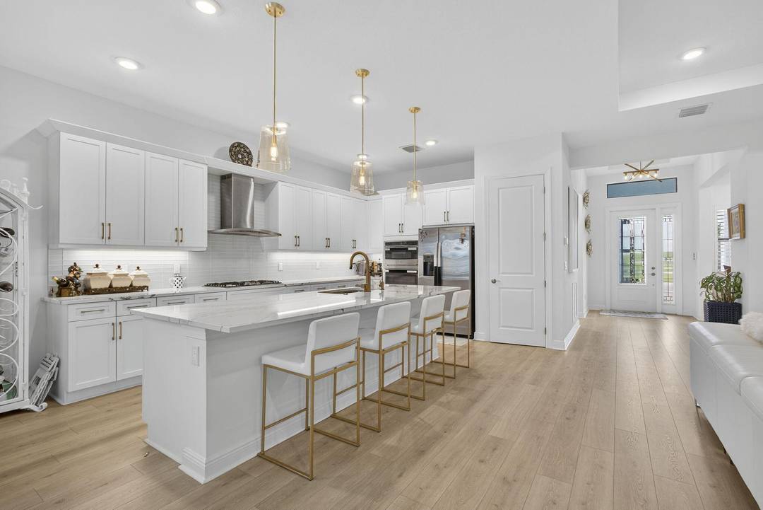 FINISHED IN 2023 PALM BEACH floor plan with lake view includes 3 bedrooms, 3 full ensuite bathrooms and 1 half powder room.