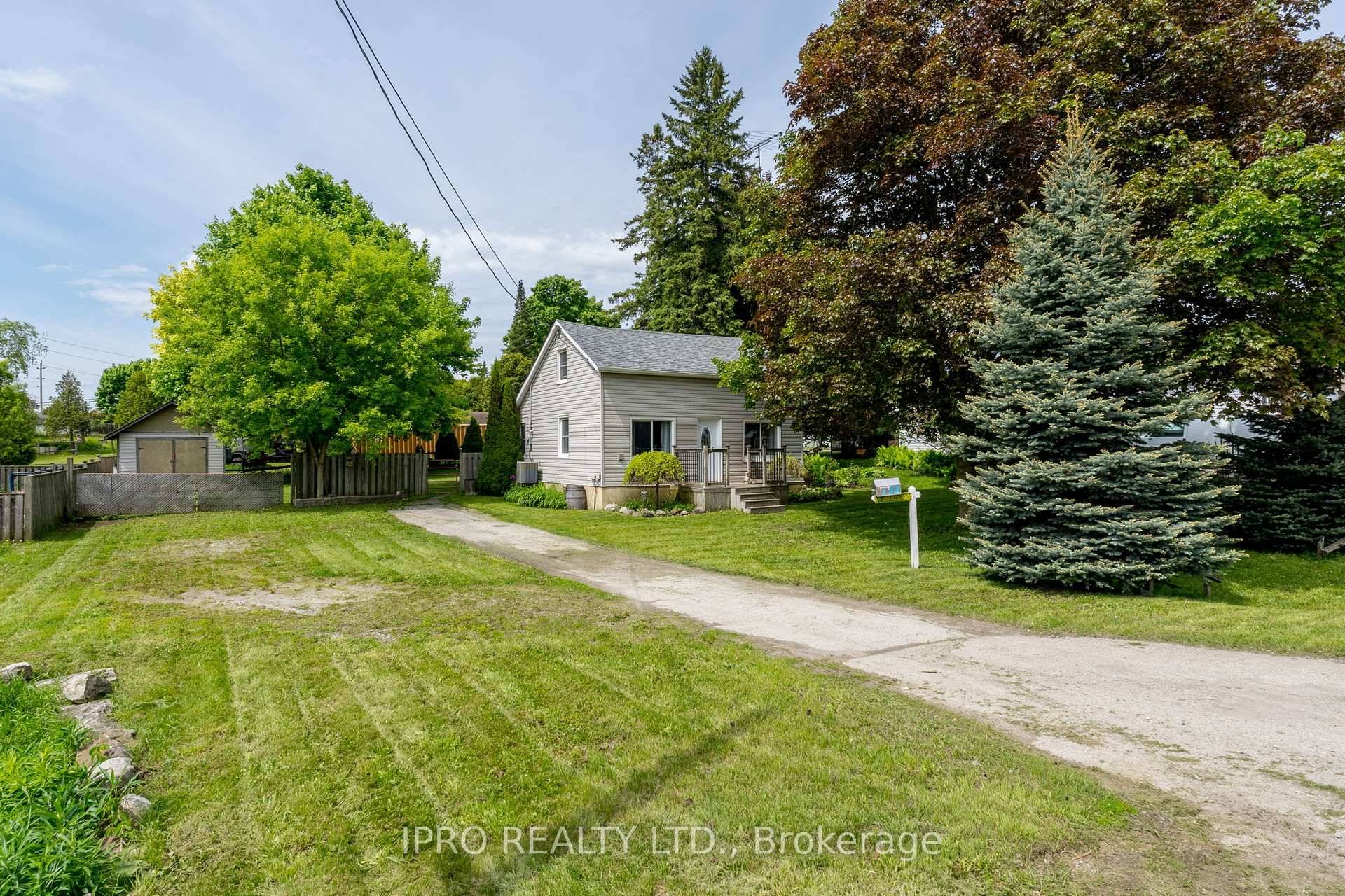 Well set back from the road, this charming 2 bed, 2 bath home is set on a huge 74 x 120 ft.