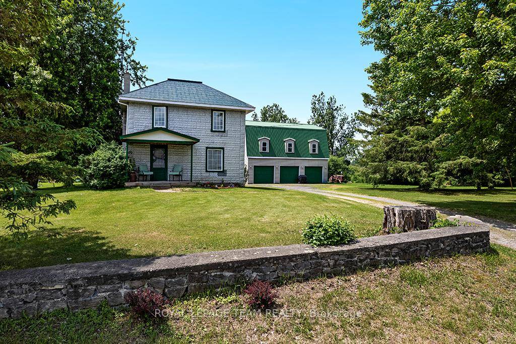 Nestled on over 4 picturesque acres just outside the charming village of Spencerville, this beautifully updated 2 storey farmhouse blends rustic charm with modern convenience.