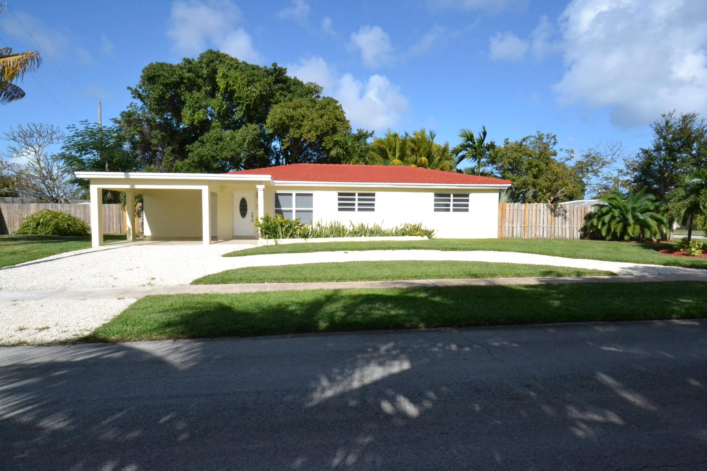 Wonderful 4 bed, 2 bath home in East Boca Raton sits on an oversized 1 4 acre corner lot.
