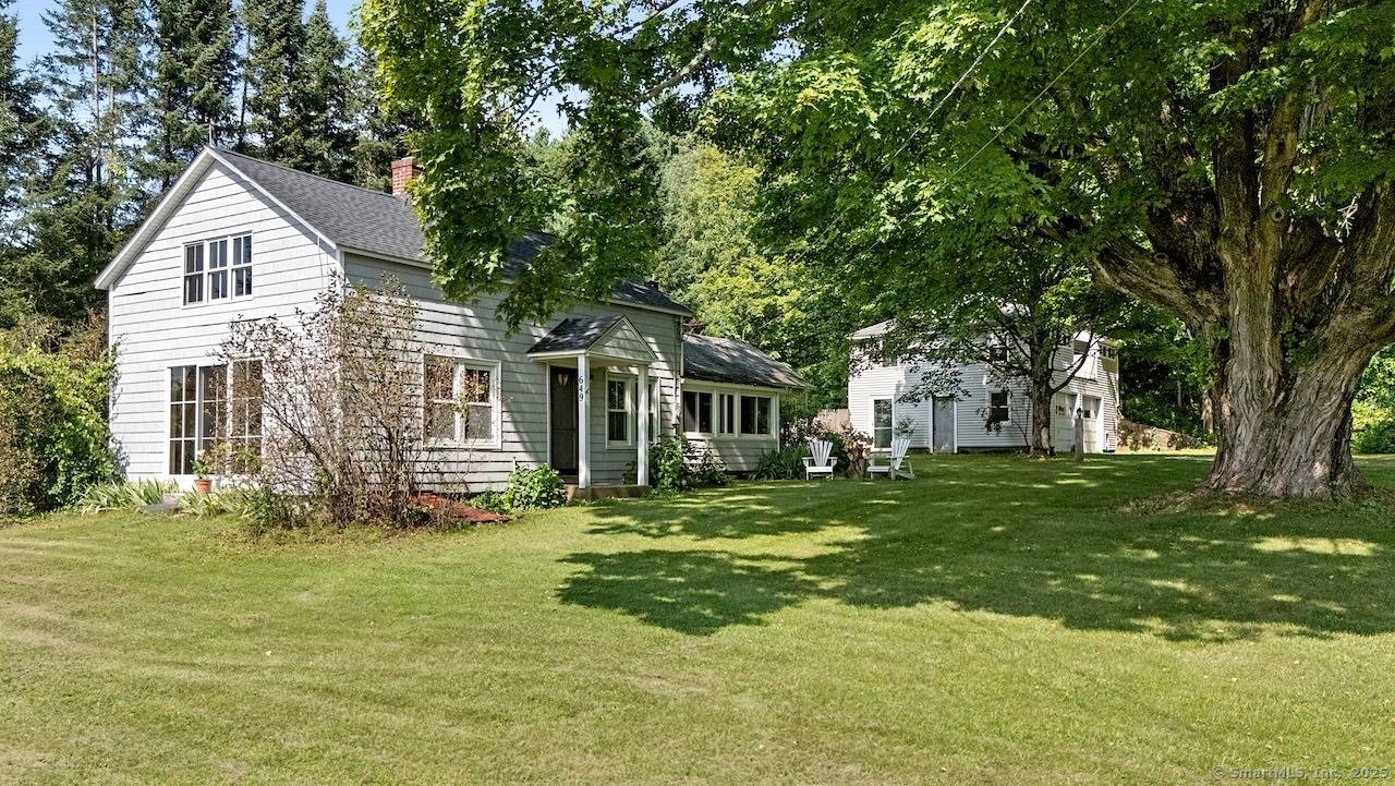 1900s Berkshire Farmhouse with Studio Carriage House Perched along a pastoral country road in Sheffield, this early 1900s farmhouse and carriage house command sweeping western views across protected conservation land.