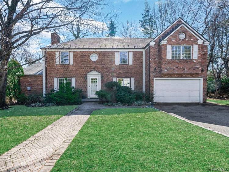 Welcome to 2 Amherst Road, a classic brick Colonial located on a quiet cul de sac in the Village of Great Neck Estates.