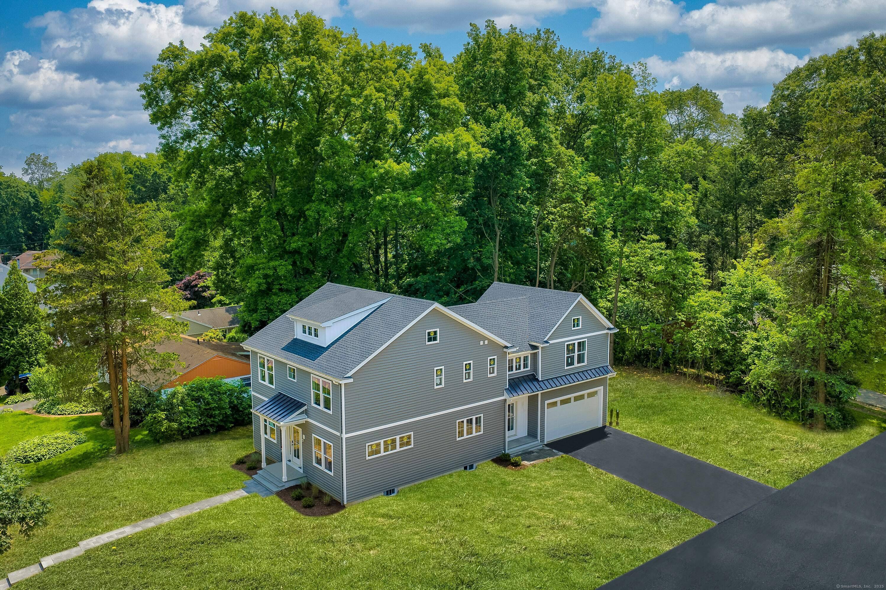 Absolutely GORGEOUS new construction, elegantly crafted, that blends modern sophistication with coastal charm in this 5 BDR, 4.