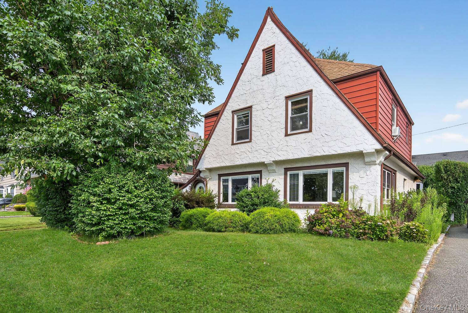 A sun filled Tudor style home in the highly sought after Village of Garden City.