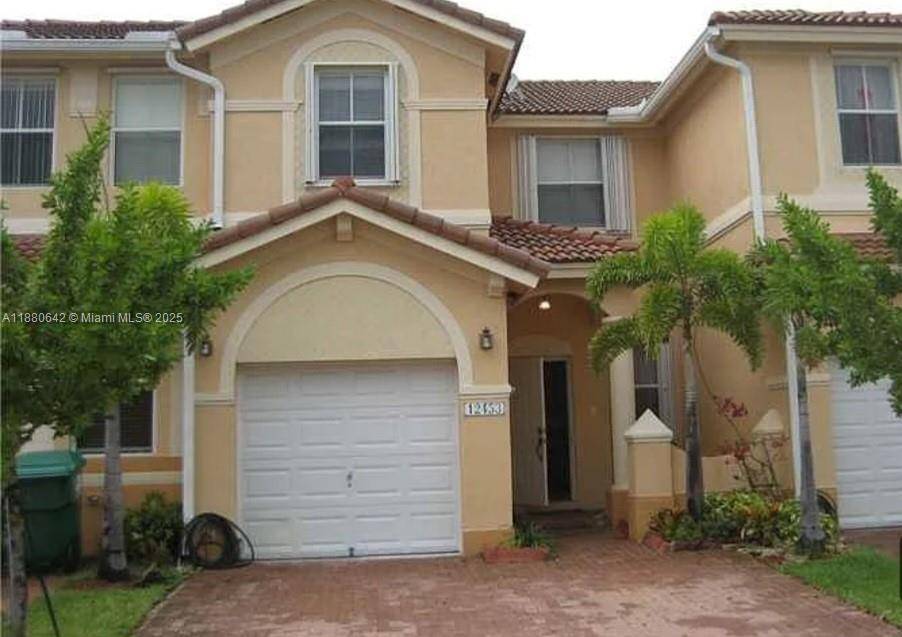 This two story townhouse in the Kendall Breeze South community offers a spacious and move in ready living space.