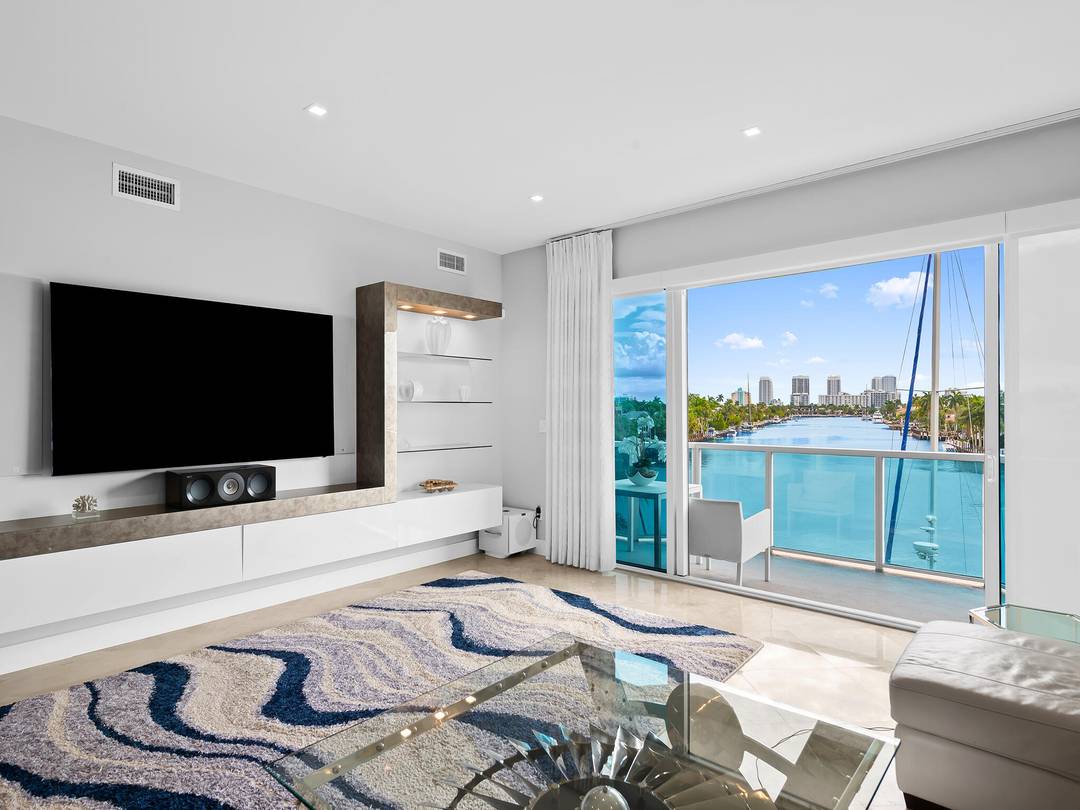 Completely renovated to the highest standards, this exceptional residence at Aria offers refined waterfront living with breathtaking open views.