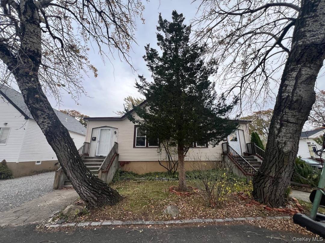LEGAL TWO FAMILY ! ! Nestled in the heart of Bayville, this Legal Two Family property at 5 4th Street offers versatility and potential.