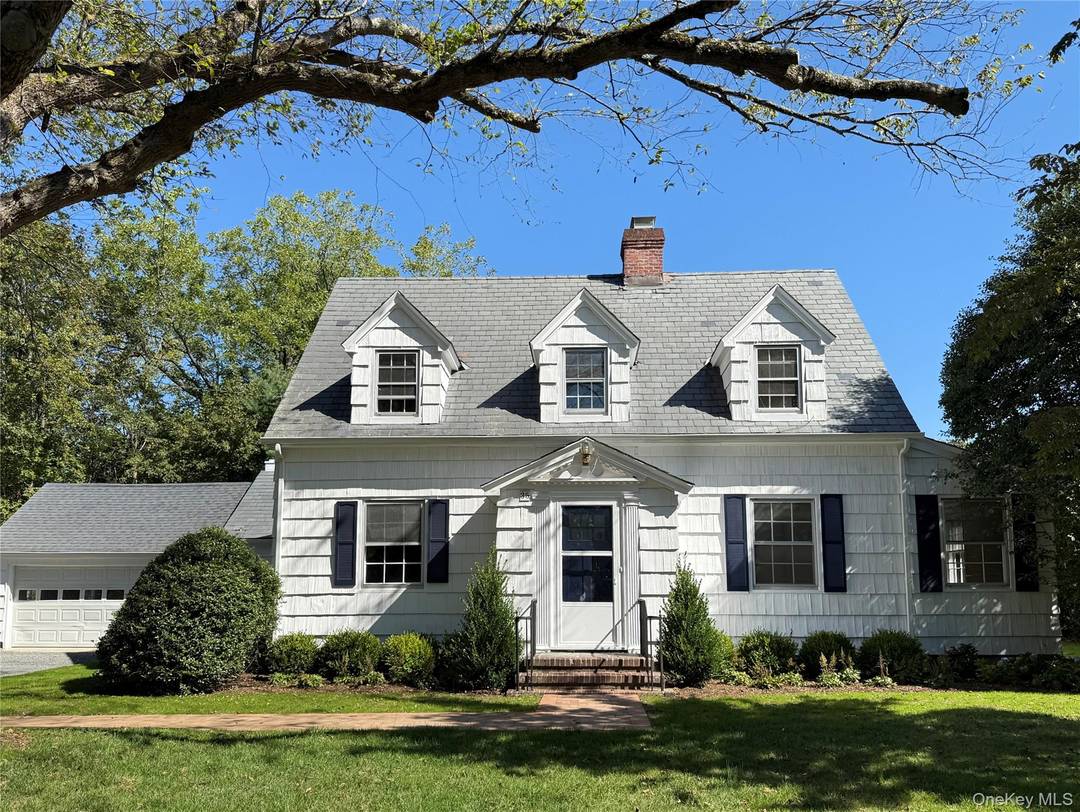 Nestled along a picturesque, tree lined, winding road that evokes the peaceful charm of the countryside, this inviting home offers the perfect blend of tranquility and convenience.