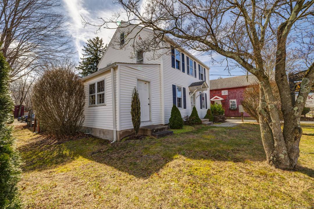 RARE OPPORTUNITY TO OWN TWO BUILDINGS IN GUILFORD Unlock the potential of this prime commercial property on the bustling Boston Post Road, just one block from Guilford's historic town Green.