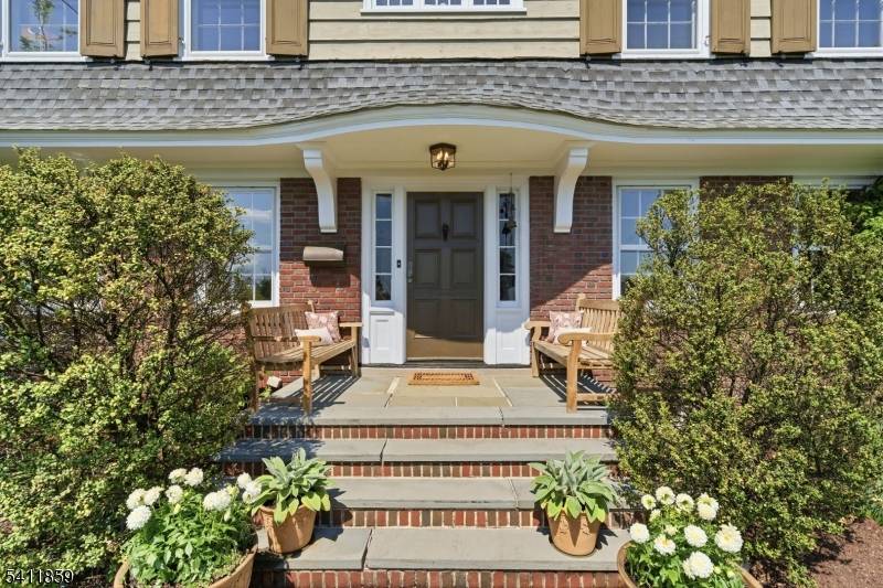 We invite you into this gracious 1922 Dutch Col on a gentle slope w views of the NYC skyline.