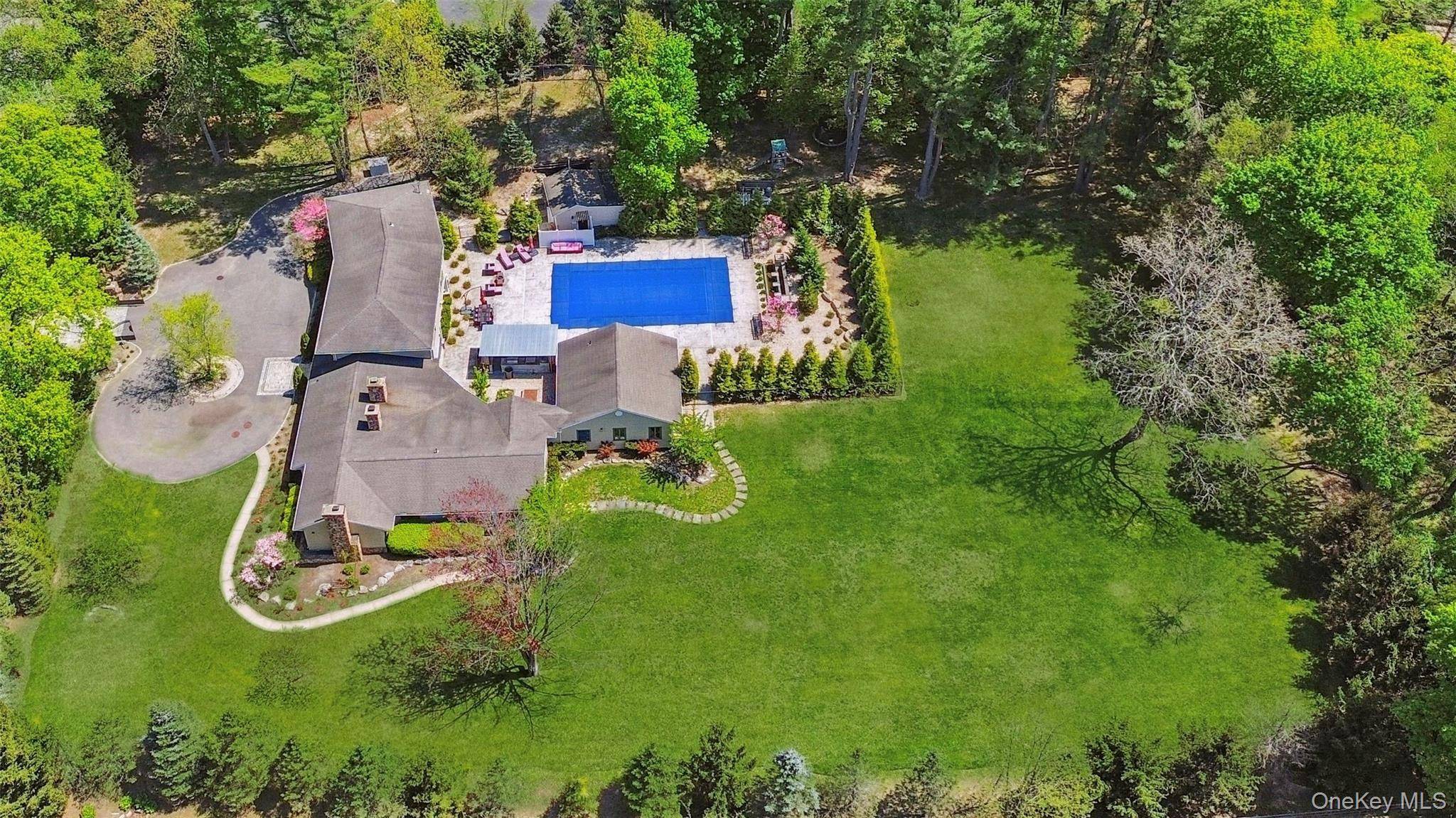 Tucked away on a fully fenced, over two acre, park like, electronic gated property, stands a sprawling Farm Rach expanded and remodeled in 2007.