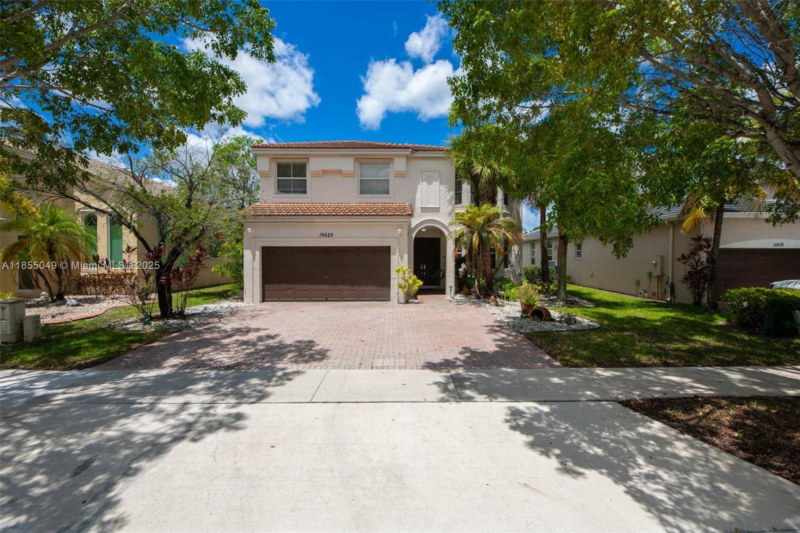 Fabulous two story home in a gated community in Riviera Isles with amazing lake view, 5 bedrooms 2.