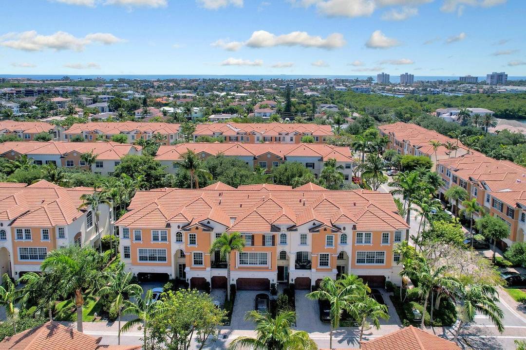 Step into the epitome of relaxed refinement with this exquisite, renovated townhouse with an elevator in the sought after community in East Boca within the prestigious gated enclave of Trieste.