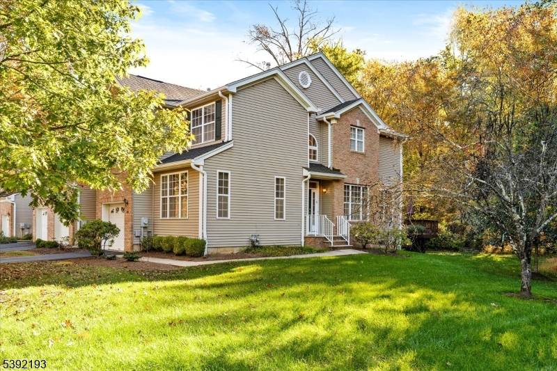 Wonderful end unit 3 BR 1900 square foot townhome backing to the woods, with wood floors, two story entry, lots of oversized windows, high ceilings, a large eat in kitchen ...
