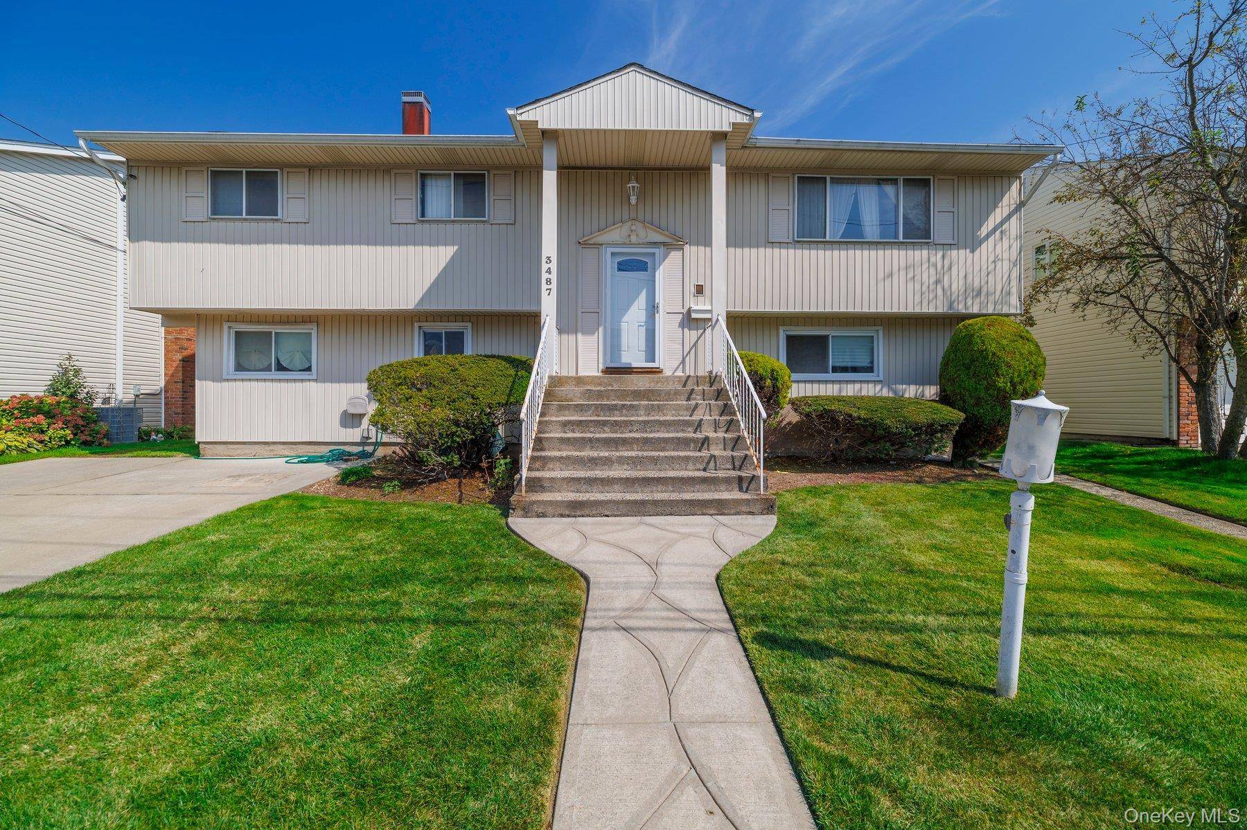 Nestled on a peaceful, dead end street, this custom, oversized hi ranch, permitted as a mother daughter home, offers 2, 505 square feet of living space.